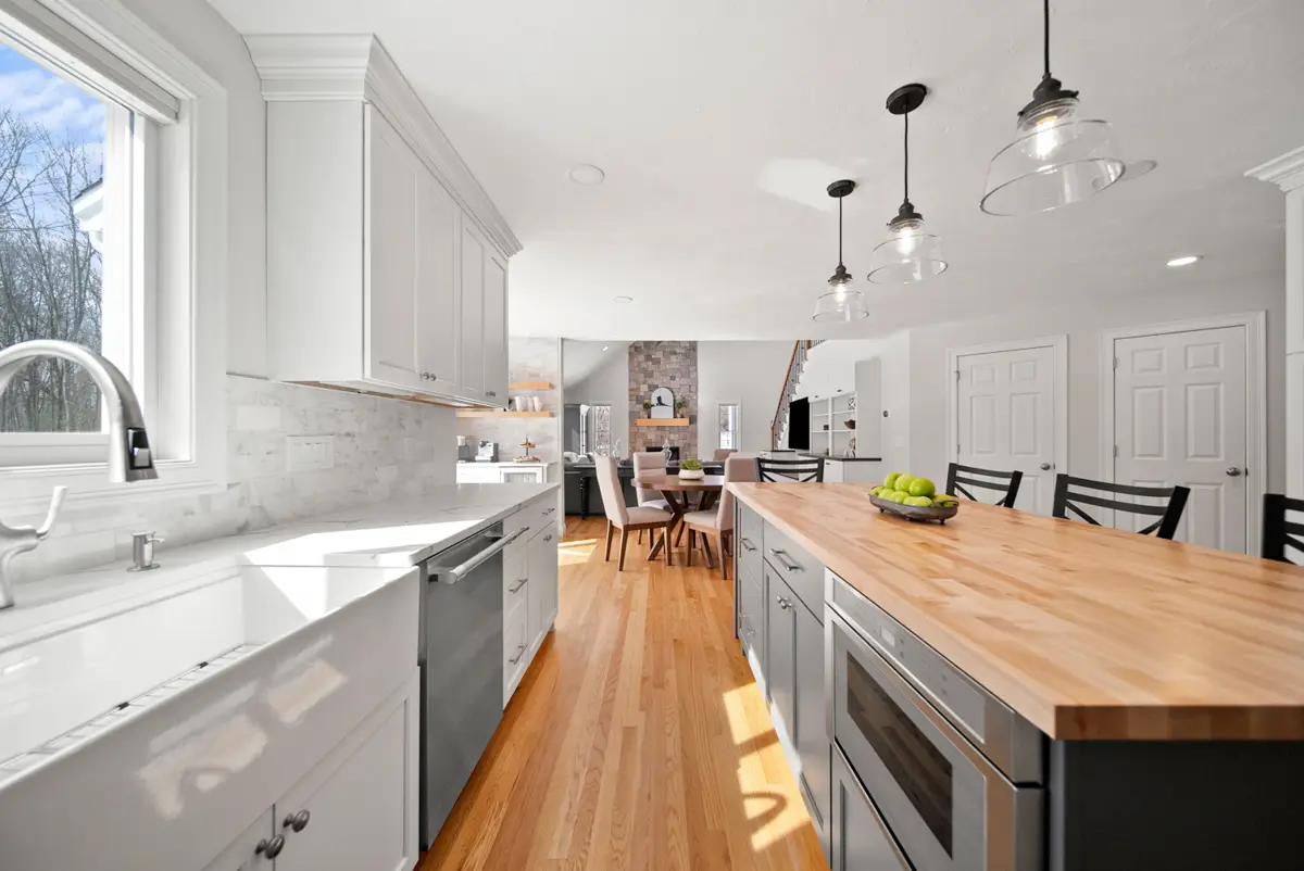 White kitchen cabinets with island installed in an Essex County Massachusetts home
