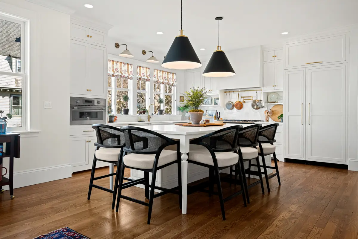 Classic New England kitchen with shaker cabinets and subway tile backsplash