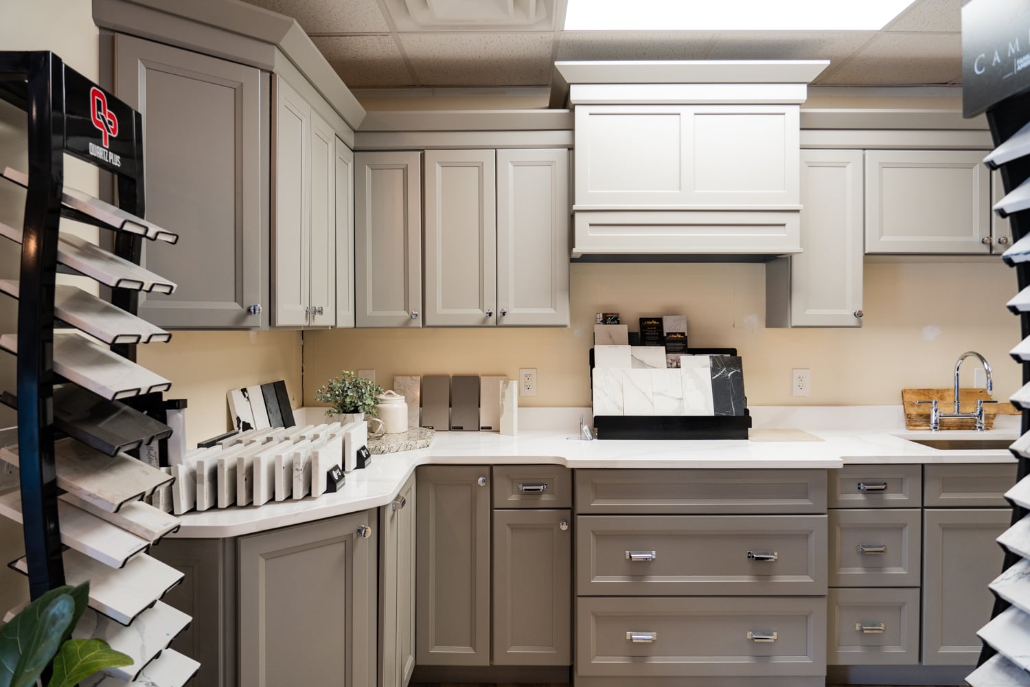 Countertop material displays including quartz and granite