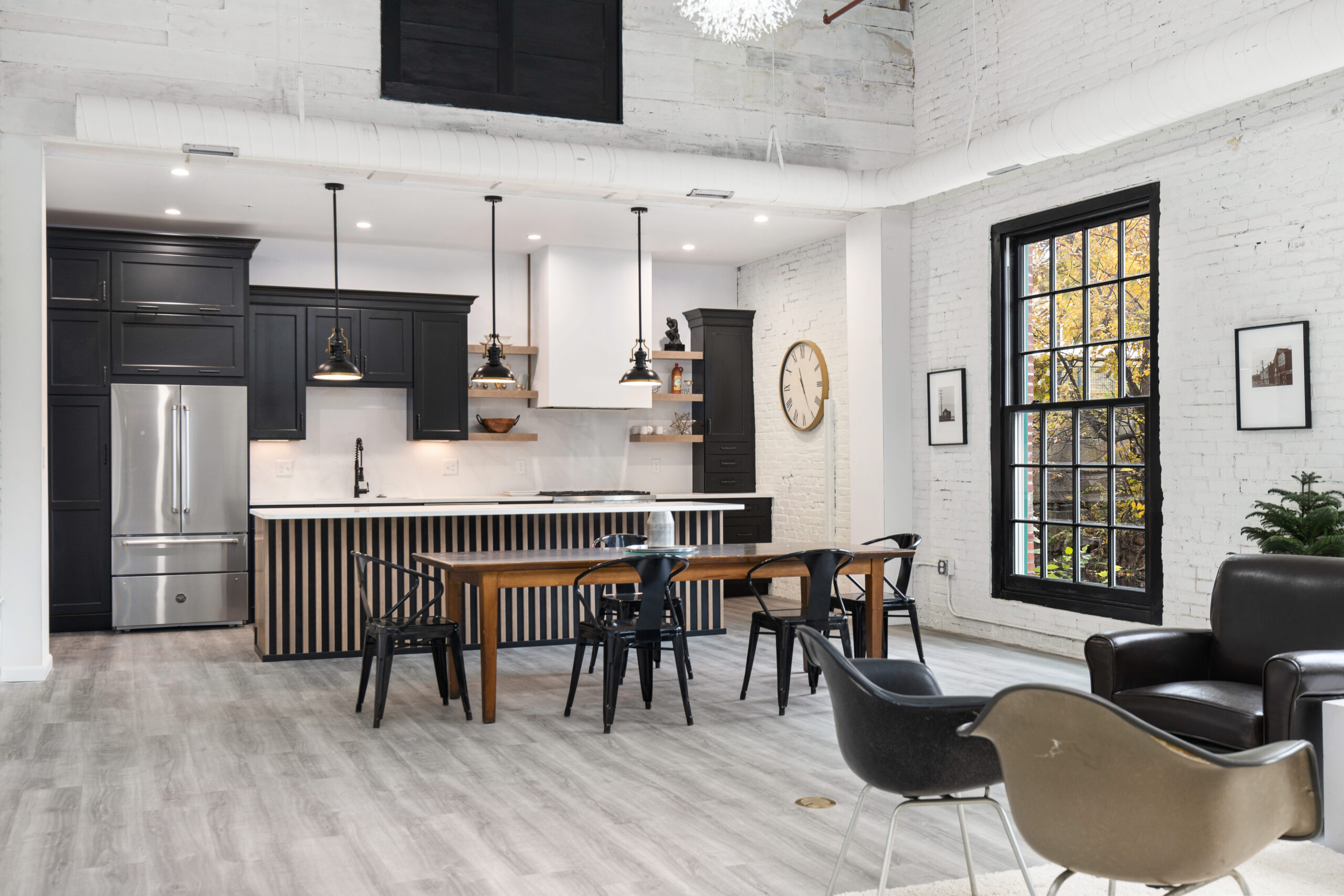Modern white and wood kitchen with sleek slab doors and contemporary design in North Shore MA