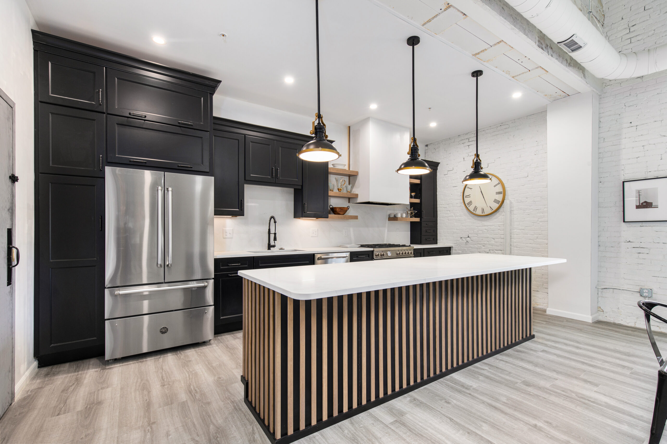 Modern kitchen island with quartz countertops and minimalist design Massachusetts