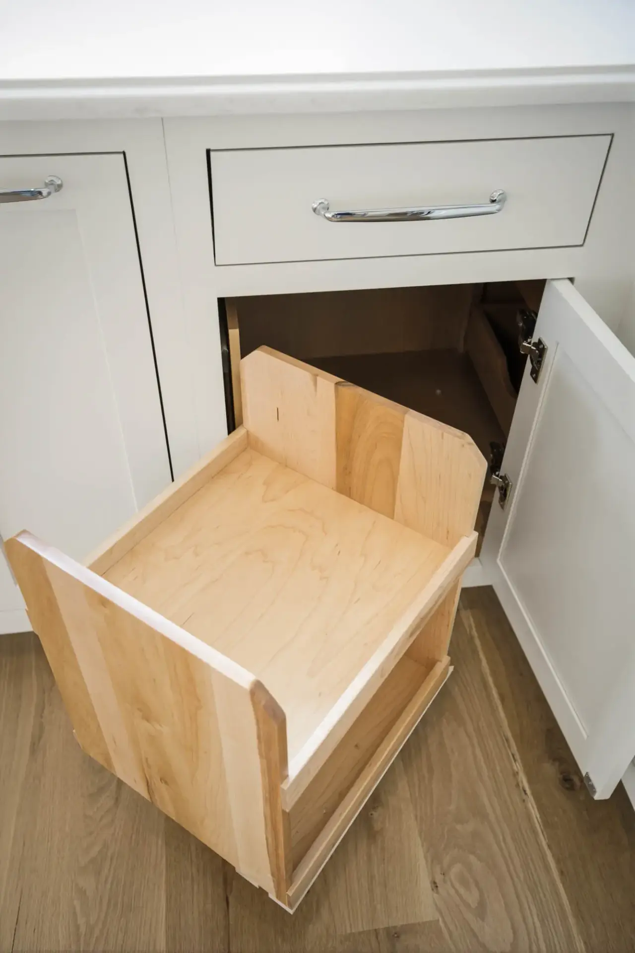 Homeowner examining budget plan for kitchen cabinets with materials and design resources